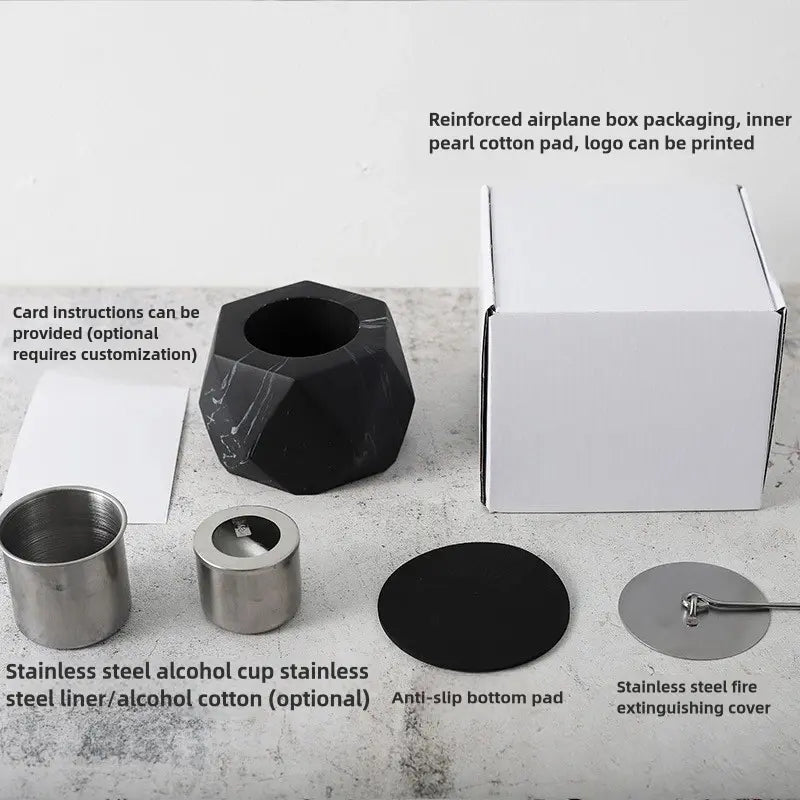 Collection of stainless steel and black alcohol cups with packaging on a white surface.