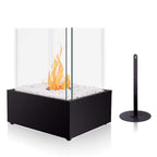Modern indoor fireplace with glass front and black base on a white background